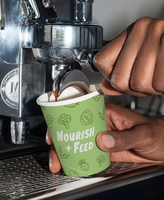 Close up of coffee cup with custom icons for hospitality branding in Perth